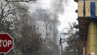 Smoke rises from a site of an attack at Shahr-e-naw which is city's one of main commercial areas in Kabul on December 12, 2022. Photo by Wakil Kohsar / AFP