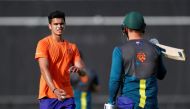 File photo: Arjun Tendulkar, son of Sachin Tendulkar, speaks with Australia's Aaron Finch during training Action Images via Reuters/Paul Childs/File Photo