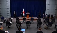 Japan's Prime Minister Fumio Kishida (centre) attends a press conference in Tokyo on December 16, 2022. (Photo by David Mareuil / AFP)