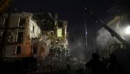 Rescuers work at the site of a residential building damaged by a Russian missile, amid Russia's attack on Ukraine, in Kryvyi Rih, Ukraine, December 16, 2022. (REUTERS/Mykola Synelnykov) 