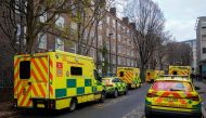 Ambulances are parked outside the Waterloo ambulance station in London on December 21, 2022. (Photo by Niklas Halle'n / AFP)