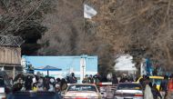 Members of the Taliban stand guard at the entrance gate of Kabul University in Kabul, Afghanistan, December 21, 2022. (REUTERS/Ali Khara)