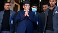 Nepal's former guerrilla leader Pushpa Kamal Dahal (second left), better known by his nom de guerre Prachanda gestures to media representatives as he leaves for the president's office to claim majority for his appointment as the new prime minister, in Bhaktapur on the outskirts of Kathmandu on December 25, 2022.  (Photo by Dipesh Shrestha / AFP)