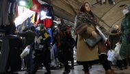 Iranians walk through Tehran Bazaar, in Tehran, Iran December 25, 2022. (Majid Asgaripour/West Asia News Agency via REUTERS)