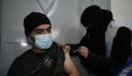 A beneficiary is receiving a shot under the WHO’s COVID-19 vaccination campaign in northern Syria.