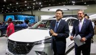 Chinese Ambassador to the US Qin Gang (left) and General Motors President Mark Reuss during a media day of the North American International Auto Show in Detroit, Michigan, US, September 14, 2022. (REUTERS/Rebecca Cook)