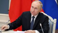 Russian President Vladimir Putin holds a meeting with Chinese President Xi Jinping via a video link at the Kremlin in Moscow on December 30, 2022. (Photo by Mikhail Klimentyev / SPUTNIK / AFP)