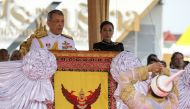 Theerapat Prayurasiddh, permanent secretary of the Thai Ministry of Agriculture and Cooperatives, dressed in a traditional costume, greets Thailand's King Maha Vajiralongkorn Bodindradebayavarangkun and Princess Bajrakitiyabha during the annual Royal Ploughing Ceremony in central Bangkok, Thailand, May 12, 2017. REUTERS/Athit Perawongmetha/File Photo