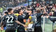  Napoli's Macedonian midfielder Eljif Elmas (C) celebrates with Napoli's Italian defender Giovanni Di Lorenzo (L) and Napoli's Nigerian forward Victor Osimhen after scoring a penalty during the Italian Serie A football match between Sampdoria and Napoli on January 8, 2023 at the Luigi-Ferraris stadium in Genoa. (Photo by Andreas SOLARO / AFP