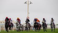 Action during the Athbah Cup race at Al Uqda Racecourse.