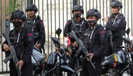 Mobile brigade police personnel stand guard outside the Surabaya court ahead of the first trial over a soccer stampede in East Java that killed 135 people in October 2022, in Surabaya, East Java province, Indonesia, January 16, 2023, in this photo taken by Antara Foto. Antara Foto/Didik Suhartono/via REUTERS 