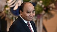 Vietnam's President Nguyen Xuan Phuc arrives to attend APEC Leader's Dialogue with APEC Business Advisory Council during the Asia-Pacific Economic Cooperation (APEC) summit, November 18, 2022, in Bangkok, Thailand. (Lillian Suwanrumpha/Pool via REUTERS)