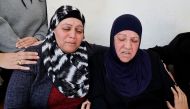Family members of a Palestinian man, who was killed by Israeli forces after an attempted stabbing, react, near Ramallah, in the Israeli-occupied West Bank, January 21, 2023. REUTERS/Ammar Awad