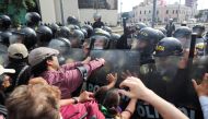 Anti-government protesters clash with the police, as they demand the release of protesters detained in the protests, after President Pedro Castillo was ousted, in Lima, Peru, January 21, 2023. (REUTERS/Sebastian Castaneda)