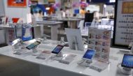 Mobile phones are seen on display at an electronics market in Shanghai, China, June 24, 2015. Picture taken June 24, 2015. REUTERS/Aly Song
