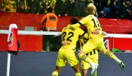 Dortmund's players celebrate a goal during the German Bundesliga match between Bayer 04 Leverkusen and Borussia Dortmund in Leverkusen, western Germany on January 29, 2023. (Photo by SASCHA SCHUERMANN / AFP)