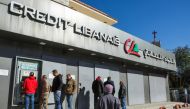 People gather outside a fortified Credit Libanais Bank in Chtaura, Lebanon, January 20, 2023. REUTERS/Mohamed Azakir