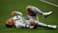 Paris Saint-Germain's French forward Kylian Mbappe lies on the ground after getting injured during the French L1 football match between Montpellier Herault SC and Paris Saint-Germain (PSG) at Stade de la Mosson in Montpellier, southern France on February 1, 2023. (Photo by Sylvain THOMAS / AFP)