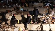 Rescuers search for victims and survivors amidst the rubble of collapsed buildings in Kahramanmaras, Turkey, after a 7.8-magnitude earthquake struck the country's southeast on February 7, 2023. Photo by Adem ALTAN / AFP
