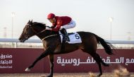 Jockey Carlos Henrique guides Inherent towards the finish line.