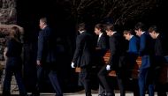 The casket is carried during the funeral for Brian Fraser on February 18, 2023 at St. Paul on the Lake Catholic Church in Grosse Pointe Farms, Michigan. Brian Fraser was one of three students killed in the shooting that occurred at Michigan State University on Monday, February 13, 2023. Nic Antaya/Getty Images/AFP
