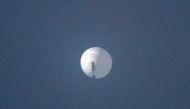 In this file photo taken on February 01, 2023 this handout photo from Chase Doak and released on February 2 shows a suspected Chinese spy balloon in the sky over Billings, Montana. Photo by Chase DOAK / CHASE DOAK / AFP

