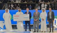 Dominic Genetti, President and General Manager of ExxonMobil Qatar, presentes the donation to Emad Al Khaja, Chief Executive Officer of INJAZ Qatar, in the presence of H E Nasser bin Ghanim Al Khelaifi, President of Qatar Tennis Federation, and Neil Chapman, Senior Vice President of Exxon Mobil Corporation.