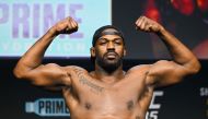 US mixed martial arts fighter Jon Jones stands on a scale during the weigh-in before his UFC 285 heavyweight title bout against French mixed martial arts fighter Ciryl Gane at the MGM Garden Arena, in Las Vegas, Nevada on March 3, 2023. (Photo by Patrick T. Fallon / AFP)
