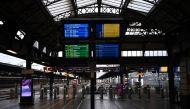 Screens display information above empty forecourts and platforms at the Gare de l'Est railway station in Paris, on March 7, 2023 (Photo by Christophe ARCHAMBAULT / AFP)