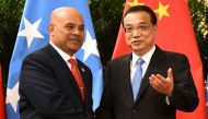 (FILES) This file photo taken on December 13, 2019 shows Micronesia's President David Panuelo (L) with China's Premier Li Keqiang at the Great Hall of the People in Beijing. - Panuelo has accused China of bribery, harassment and 