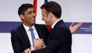 French President Emmanuel Macron shakes hands with British Prime Minister Rishi Sunak at the end of a press conference with British Prime Minister as part of the Franco-British Summit held at the Elysee Palace in Paris, on March 10, 2023. (Photo by GONZALO FUENTES / AFP)