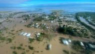 This handout photo taken on March 10, 2023 and received on March 11, 2023 from the Queensland Police Service shows an aerial view of the flooded northern Queensland town of Burketown. (Photo by Handout / QUEENSLAND POLICE SERVICE / AFP) 