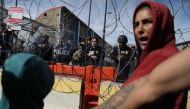 Migrants, mostly of Venezuelan origin, attempt to forcibly cross into the United States at the Paso del Norte International Bridge in Ciudad Juarez, Chihuahua state, Mexico, on March 12, 2023. (Photo by Herika Martinez / AFP)