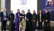 QFC, PWC and QBWA officials pose for a photograph after the event.
