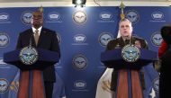 US Secretary of Defense Lloyd Austin (L) listens as Chairman of the Joint Chiefs of Staff Army Gen. Mark Milley speaks during a press conference at the Pentagon on March 15, 2023 in Arlington, Virginia. Alex Wong/Getty Images/AFP 