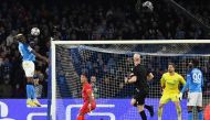 Napoli's Nigerian forward Victor Osimhen (L) shoots a header to open the scoring during the UEFA Champions League round of 16, second leg football match between SSC Napoli and Eintracht Frankfurt at the Diego-Maradona stadium in Naples on March 15, 2023. (Photo by Tiziana FABI / AFP)