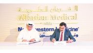 Omar Hussain Alfardan, President and CEO of Alfardan Group, and Dr. Javaid Sheikh, Dean of WCM-Q, signing the agreement.