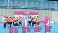 Qatar Collegiate Sports Federation President Dr. Ibrahim bin Saleh Al Naimi with Qatar Universities Handball League champions Police Institute players and officials.