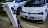 (FILES) In this file photo taken on May 18, 2022 a Volkswagen electric car is parked in front of a charging station at VW's component plant in Salzgitter, north-central Germany. (Photo by John MacDougall / AFP)