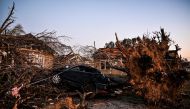 The remains of a house and cars are entangled in tree limbs in Rolling Fork, Mississippi, on March 25, 2023, after a tornado touched down in the area. (Photo by Chandan Khanna / AFP)