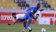 Al Duhail's Almoez Ali in action with an Al Sadd player during their Ooredoo Cup semi-final clash on Thursday. The final of the tournament will be played on March 28. 
