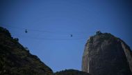 View of a Sugarloaf Cable Cars during a demonstration against proposals to create a zip line attraction at Sugarloaf Mountain in Rio de Janeiro, Brazil, on March 26, 2023. Photo by CARL DE SOUZA / AFP