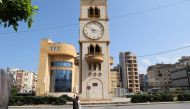 A clock tower in Beirut's Jdeideh district indicates the time on March 26, 2023, after Lebanon's government announced a decision to delay daylight savings. (Photo by Anwar Amro / AFP)