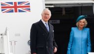 Britain's King Charles III (L) and Britain's Camilla, Queen Consort get off their plane after landing at Berlin Brandenburg Airport in Schoenefeld near Berlin, on March 29, 2023. Photo by Odd ANDERSEN / AFP