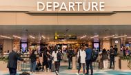 Trallers arrive at the departure hall in Singapore Changi airport in Singapore on March 31, 2023. Photo by Catherine Lai / AFP