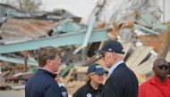 US President Joe Biden speaks with Mississippi Governor Tate Reeves (L) in Rolling Fork, Mississippi, on March 31, 2023. (Photo by Mandel NGAN / AFP)

