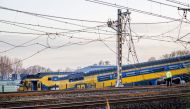 Emergency services work on the site of a derailed train in Voorschoten, on April 4, 2023. (Photo by Remko de Waal / ANP / AFP) 