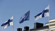 Finnish and Nato flags flutter at the courtyard of the Foreign Ministry in Helsinki, Finland, ahead of accession to the North Atlantic Treaty Organization (NATO) on April 4, 2023. Photo by Antti Hنmنlنinen / Lehtikuva / AFP