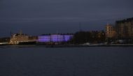 The building of the Foreign Ministry is illuminated to mark Finland joining NATO in Helsinki, Finland, on April 4, 2023. (Photo by Markku Ulander / Lehtikuva / AFP)
