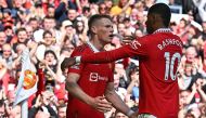Manchester United's Scottish midfielder Scott McTominay (L) celebrates scoring the opening goal with Manchester United's English striker Marcus Rashford during the English Premier League football match between Manchester United and Everton at Old Trafford in Manchester, north west England, on April 8, 2023. (Photo by Paul ELLIS / AFP) 
